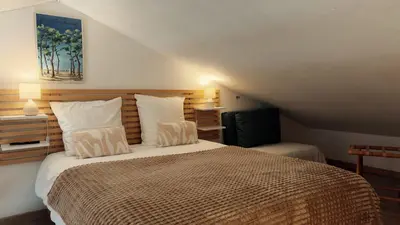 Un ou plusieurs lits dans un hébergement de l'établissement L'Atlantide Maison & Spa - Accès direct à la plage