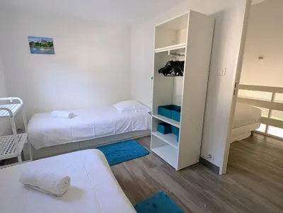 Un ou plusieurs lits dans un hébergement de l'établissement Maison dans résidence avec piscine et tennis - 4 personnes