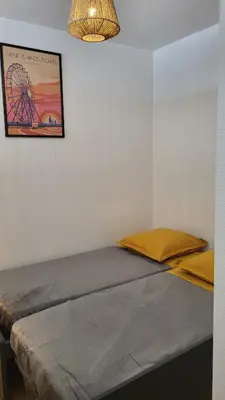 Un ou plusieurs lits dans un hébergement de l'établissement Appartement de charme, face à l'ocean