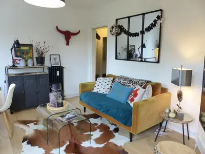 Coin salon dans l'établissement PROCE - Apt lumineux et cosy, vue parc de Procé