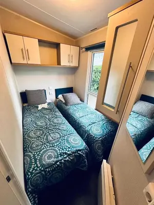 Un ou plusieurs lits dans un hébergement de l'établissement Bungalow accueillant à Saint-Jean-de-Monts avec piscine