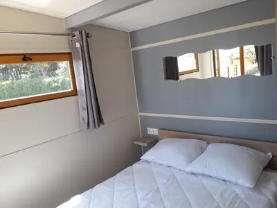 Un ou plusieurs lits dans un hébergement de l'établissement Camping l'Albatros