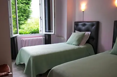 Un ou plusieurs lits dans un hébergement de l'établissement La Villa de Domitille