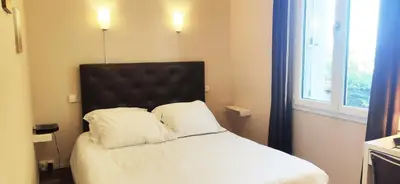 Un ou plusieurs lits dans un hébergement de l'établissement La Villa de Domitille