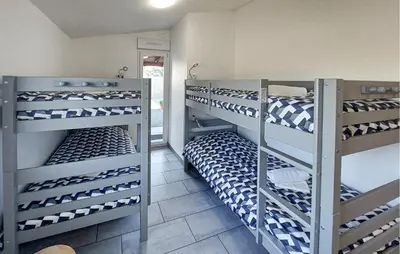 Un ou plusieurs lits superposés dans un hébergement de l'établissement Villa Avec Piscine Privée