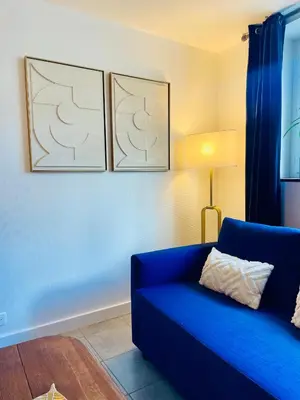 Coin salon dans l'établissement M La Madeleine L'Appartement