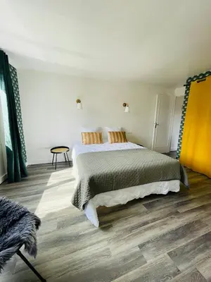 Un ou plusieurs lits dans un hébergement de l'établissement M La Madeleine L'Appartement