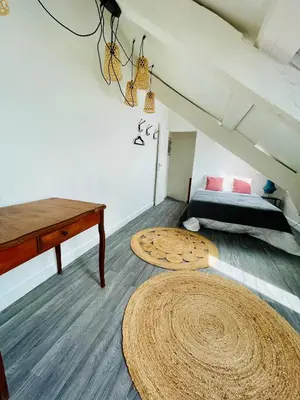 Un ou plusieurs lits dans un hébergement de l'établissement M La Madeleine L'Appartement