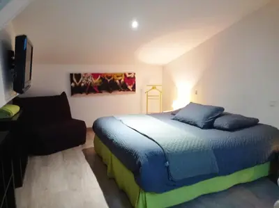 Un ou plusieurs lits dans un hébergement de l'établissement Domaine des Ecoliers - Gîte 123 soleil - Parking privé