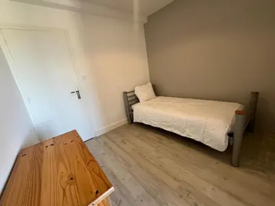 Un ou plusieurs lits dans un hébergement de l'établissement Appartement vue océan