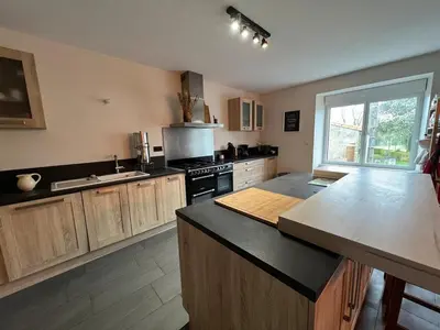 Cuisine ou kitchenette dans l'établissement A 9 min du 