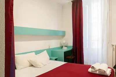 Un ou plusieurs lits dans un hébergement de l'établissement Hôtel De La Gare Nantes Station Hotel Nantes