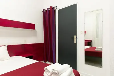 Un ou plusieurs lits dans un hébergement de l'établissement Hôtel De La Gare Nantes Station Hotel Nantes