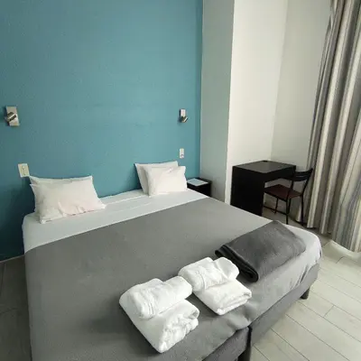 Un ou plusieurs lits dans un hébergement de l'établissement Hôtel De La Gare Nantes Station Hotel Nantes