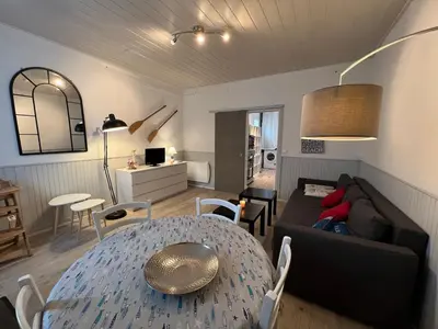 Coin salon dans l'établissement Maison 47m2 meublée 200m plage