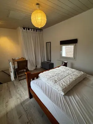 Un ou plusieurs lits dans un hébergement de l'établissement Maison 47m2 meublée 200m plage