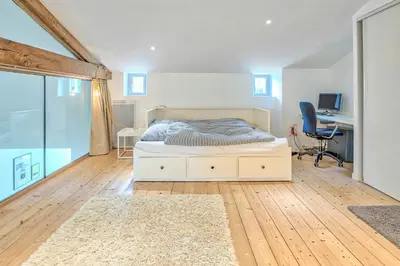 Un ou plusieurs lits dans un hébergement de l'établissement Renovated Chalet In The Heart Of Nature In Vendée