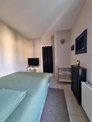Télévision ou salle de divertissement dans l'établissement Logement indépendant Sacré Coeur