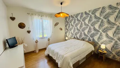 Un ou plusieurs lits dans un hébergement de l'établissement Maison proche centre ville, cosy et confort