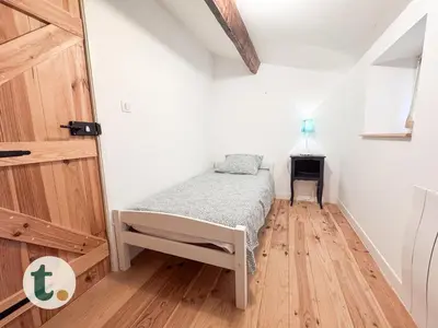 Un ou plusieurs lits dans un hébergement de l'établissement Tranquiloue - Maison paisible à 7min du PuyduFou