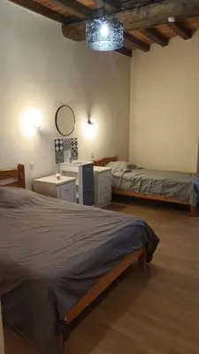 Un ou plusieurs lits dans un hébergement de l'établissement Gîte du Fourneau