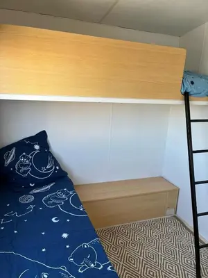 Un ou plusieurs lits dans un hébergement de l'établissement Mobil-home 5 personnes