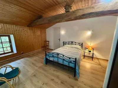 Un ou plusieurs lits dans un hébergement de l'établissement Grande Maison au Calme