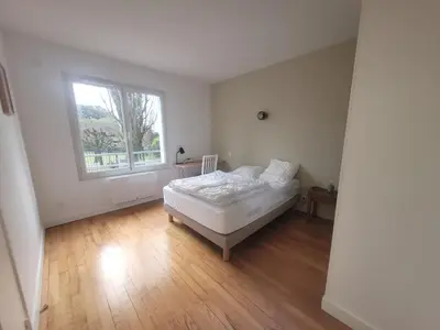 Un ou plusieurs lits dans un hébergement de l'établissement Appartement bord de mer, T4
