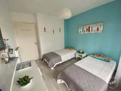 Un ou plusieurs lits dans un hébergement de l'établissement Appartement familial de 56 m², à deux pas de la mer._2