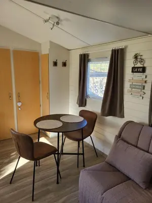Coin salon dans l'établissement Gîte Sous le Tilleul