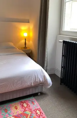 Un ou plusieurs lits dans un hébergement de l'établissement id-home Tour de Bretagne