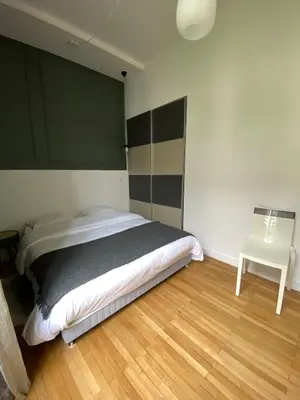 Un ou plusieurs lits dans un hébergement de l'établissement id-home Tour de Bretagne
