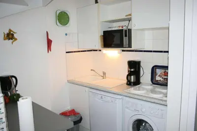 Cuisine ou kitchenette dans l'établissement Résidence Le Trimaran - Location de Vacances - PORNICHET - APPARTEMENT QUARTIER BONNE SOURCE MAE-2931