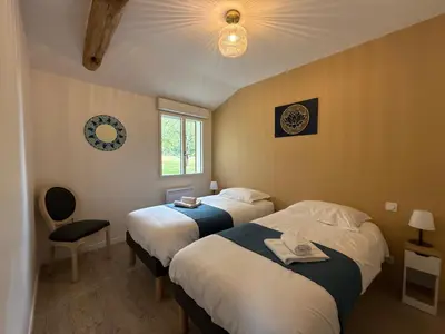 Un ou plusieurs lits dans un hébergement de l'établissement Le Verger - Gite 8 personnes en campagne et rivière By Primo