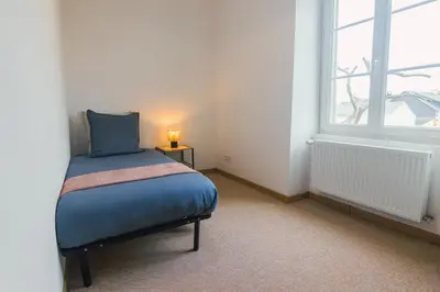 Un ou plusieurs lits dans un hébergement de l'établissement L'Alcôve, Maison 3ch avec jardin et parking