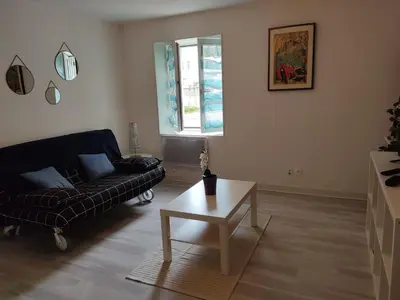 Coin salon dans l'établissement Appartement des machines