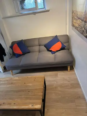 Coin salon dans l'établissement Joli logement très accueillant