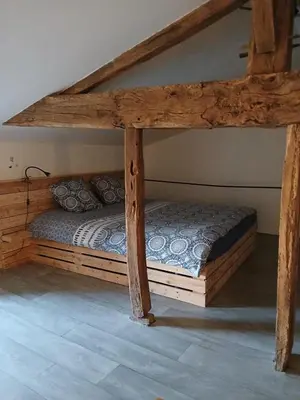 Un ou plusieurs lits dans un hébergement de l'établissement Le gîte des capucines