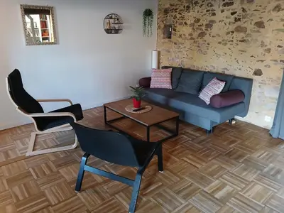 Coin salon dans l'établissement Le gîte des capucines