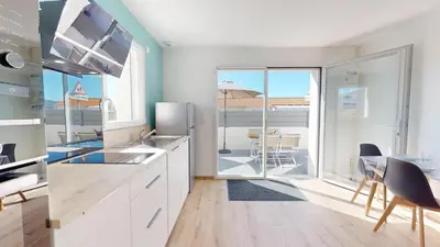 Cuisine ou kitchenette dans l'établissement La Petite Vague