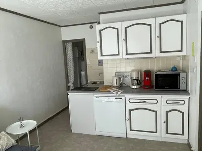 Cuisine ou kitchenette dans l'établissement Les Dunes