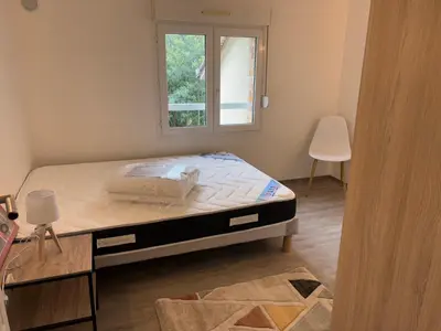 Un ou plusieurs lits dans un hébergement de l'établissement Appartement T3 - Plage à 500m
