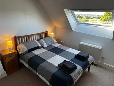 Un ou plusieurs lits dans un hébergement de l'établissement Kastellbriant Cottage
