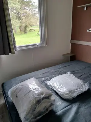 Un ou plusieurs lits dans un hébergement de l'établissement Mobil Home