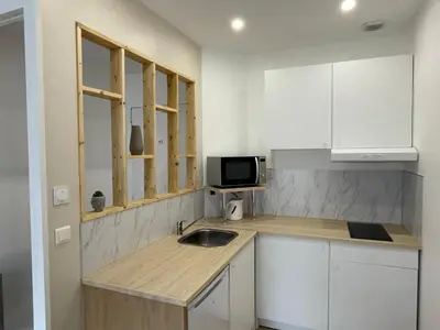 Cuisine ou kitchenette dans l'établissement Charmant T2 avec cour extérieure