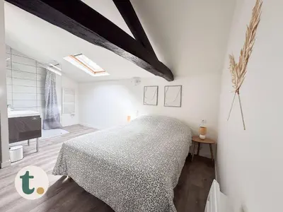 Un ou plusieurs lits dans un hébergement de l'établissement Tranquiloue - Petit Appartement - 10min Puy du Fou