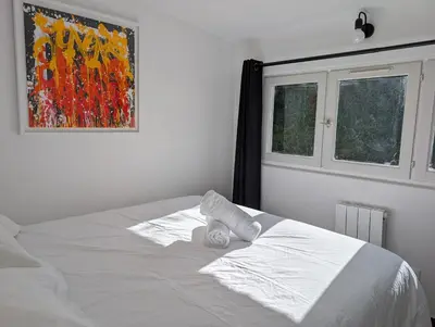Un ou plusieurs lits dans un hébergement de l'établissement Esprit vacances entre jardin & plage du Porteau