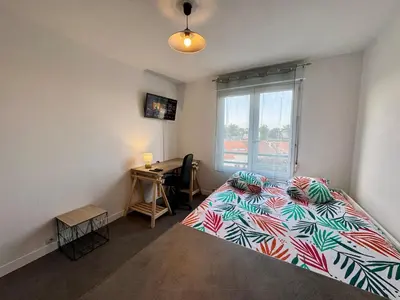 Un ou plusieurs lits dans un hébergement de l'établissement Appartement Cosy dans le Centre