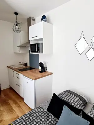 Cuisine ou kitchenette dans l'établissement Studio 1 Cozy en centre-ville - Puy duFou
