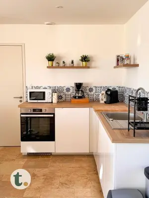Cuisine ou kitchenette dans l'établissement Tranquiloue - Maison de Campagne - PuyduFou